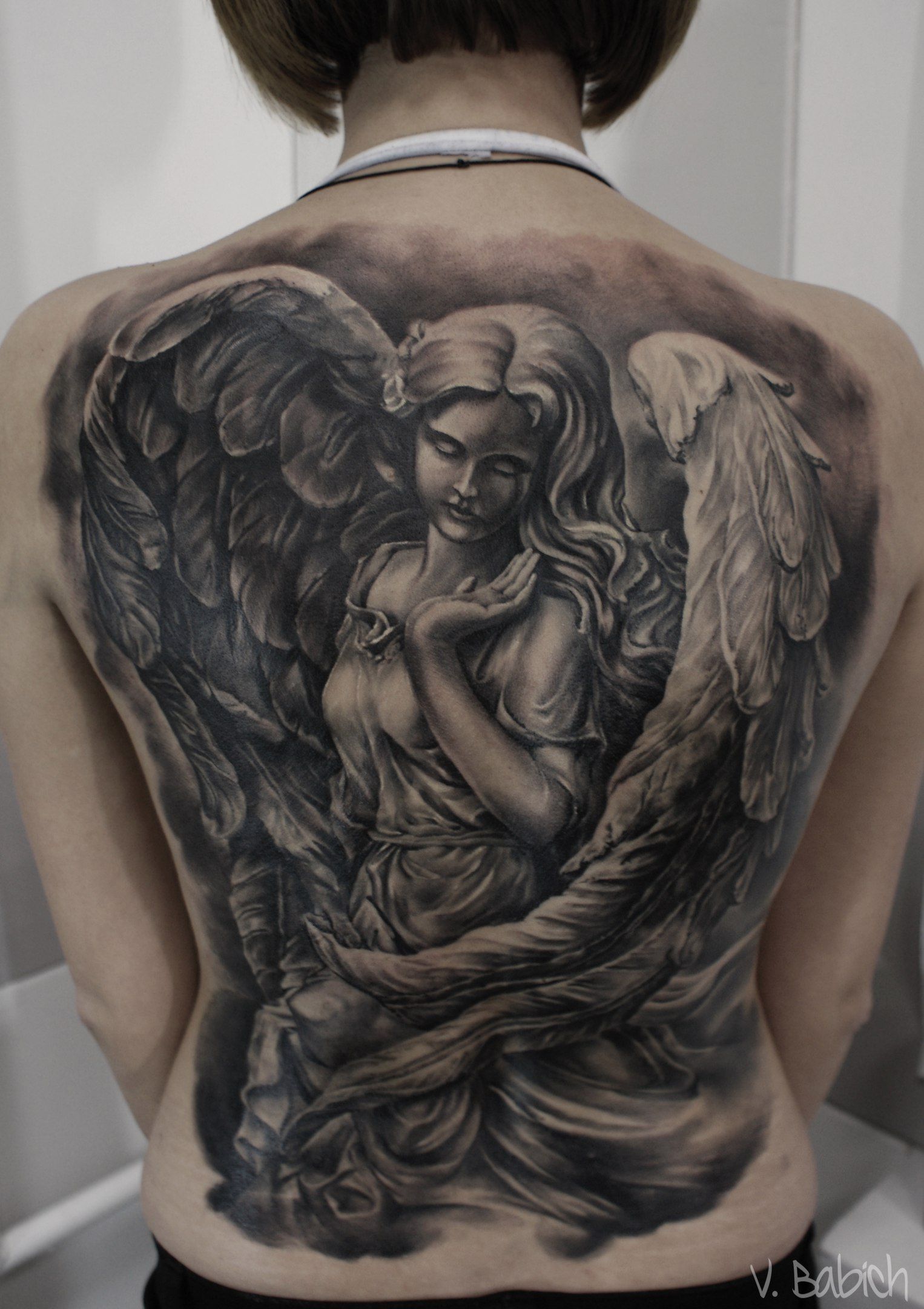 Татуировка ангела на спине